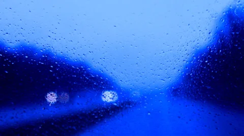 Raindrops on a car windshield blue Stock Footage 37320047