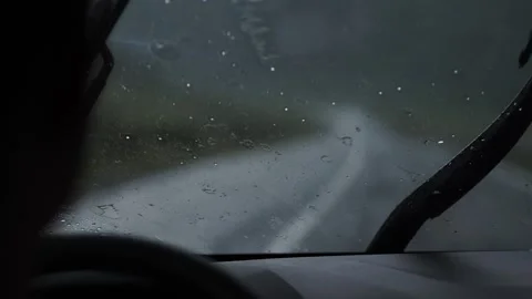 Raindrops on car windshield, car wipers Stock Footage 137228321