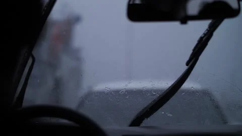 Raindrops on car windshield, car wipers	 Stock Footage 137229872