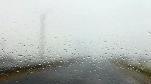Raindrops on a car windshield g Stock Footage 37320088