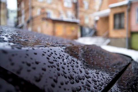 Raindrops on the carpaint with warm soft  blurred background Stock Photos