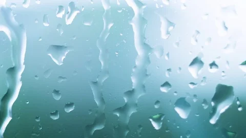 Raindrops cascading down on a window Video stock 78687870