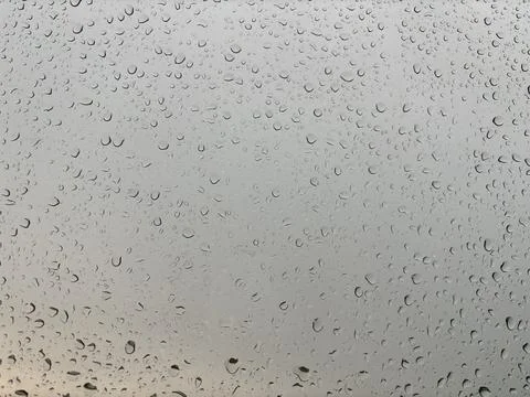 Raindrops on a City Windowpane Stock Photos
