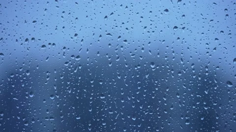 Raindrops Close-up On Blue Background 動画素材 220567597