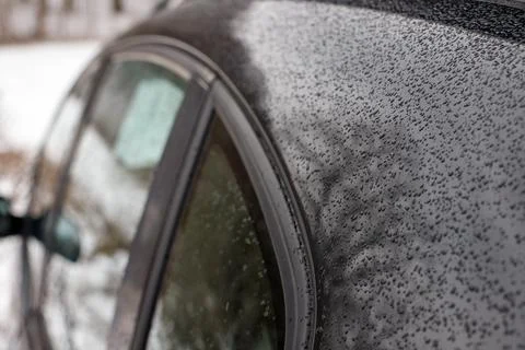Raindrops close-up on the car. erosion of machine metal. maintenance Stock-Fotos