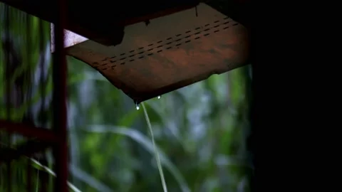 Raindrops in the corner of the house through the pipe Stock Footage 237208966