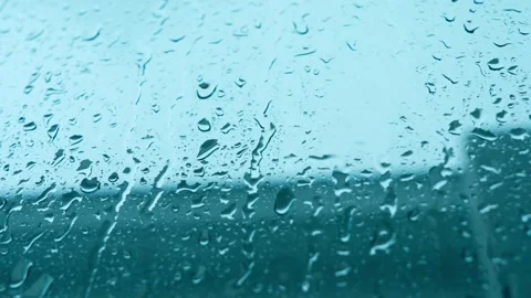 Raindrops cover a window during heavy rainfall. Stock Footage 331281081