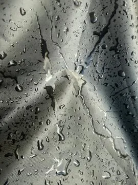 Raindrops on Dark Surface Close Up Stock Photos