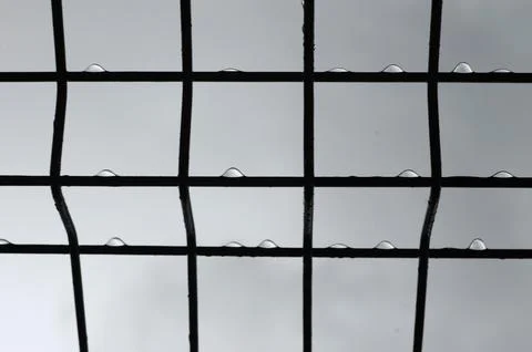 Raindrops dripped from the iron rods. Stock Photos