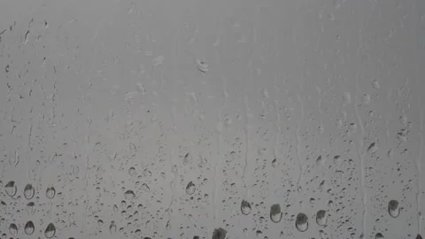 Raindrops dripping and running down the window in the rain. Stock Footage 196171681