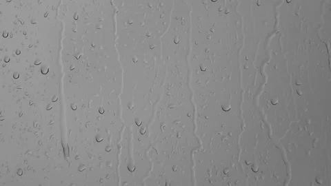 Raindrops dripping and running down the window in the rain. Stock Footage 196174981