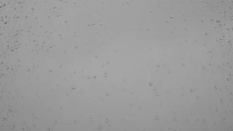 Raindrops dripping and running down the window in the rain. Stock Footage 196175578