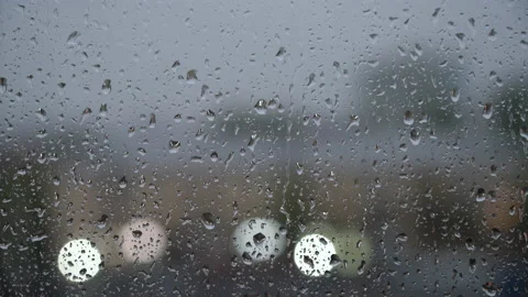 Raindrops dripping and running down the window in the rain. Stock Footage 196175790