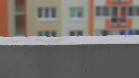 Raindrops dripping onto the concrete balcony Stock Footage 158943812