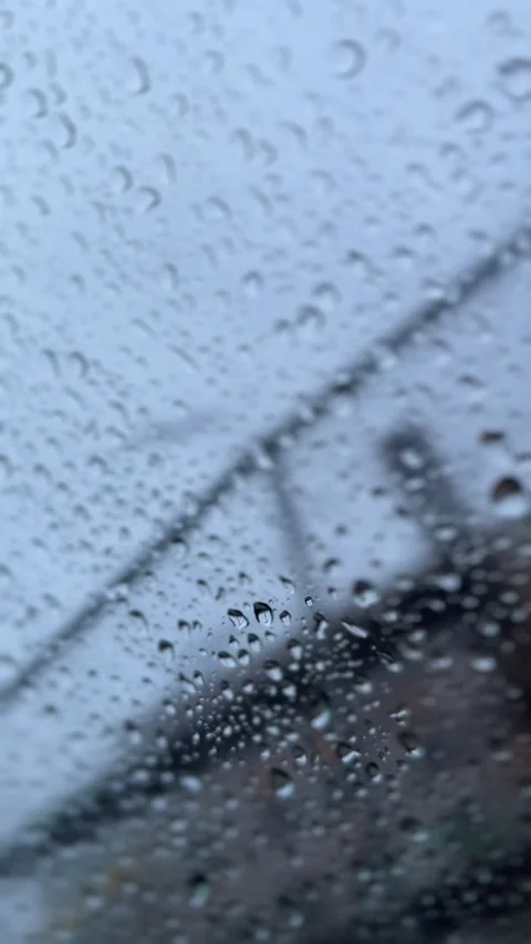 Raindrops dripping down the window Stock Footage 263656416