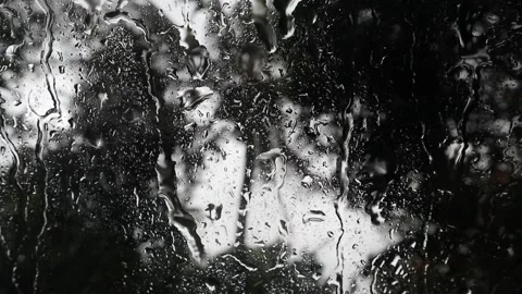 Raindrops dripping down the window glass Stock Footage 159869790