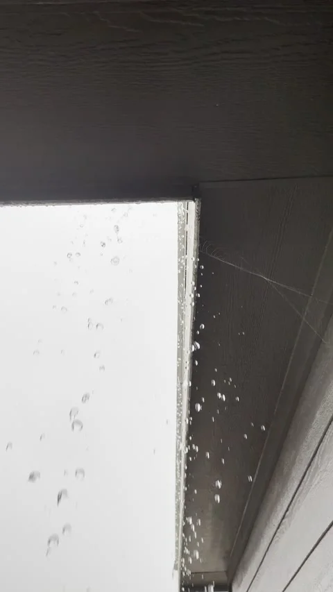 Raindrops Dripping From Roof and Gutter Edge Видео 344779355
