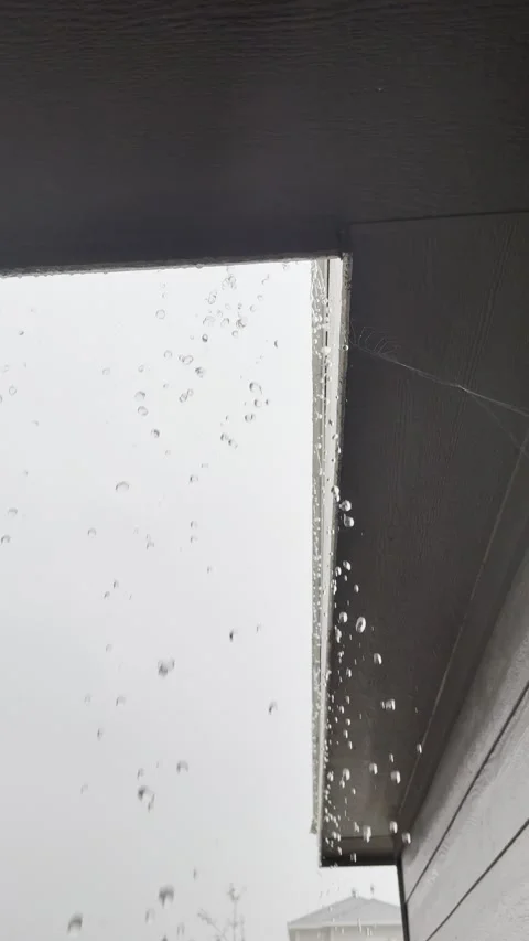 Raindrops Dripping From Roof Edge During Storm Video stock 344779364