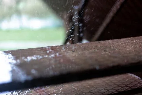 Raindrops dripping on the steps. Brown steps. Stock Photos