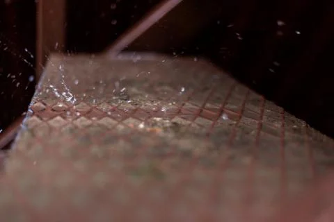 Raindrops dripping on the steps Stock Photos