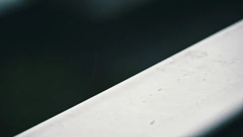 Raindrops Dripping on the Window and Windowsill in Slow Motion in Cloudy Weather Stock Footage 261586640