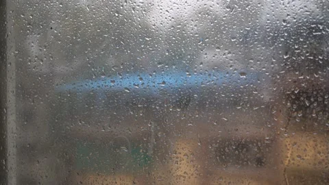 Raindrops dripping from the window Stock Footage 177914527