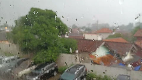 Raindrops dripping on the window pane Stock Footage 197042418