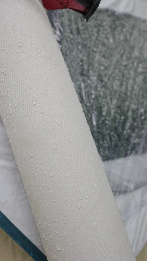 Raindrops on Durable Waterproof Fabric of Inflatable Camping Tent Video stock 341991056