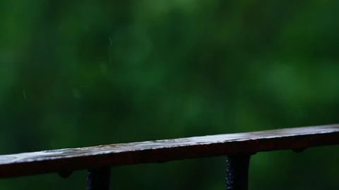 Raindrops fall and break beautifully in slow motion Stock Footage 90764280