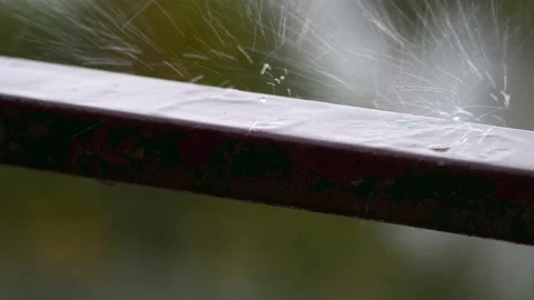 Raindrops fall on the balcony on a windy day and heavy rains Stock Footage 89444603
