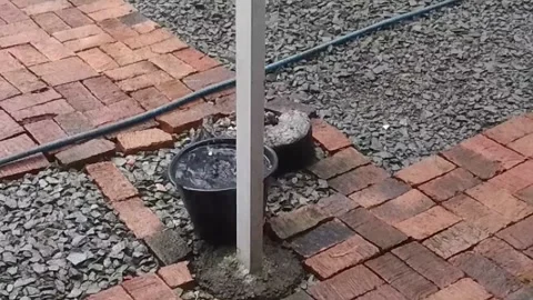 Raindrops fall into the black bucket Stock Footage 266785454
