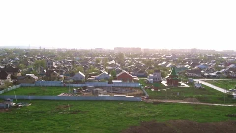 Raindrops fall on the city and field. The sun during the rain. Stock Footage 198279103