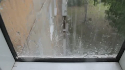 Raindrops fall on the edge of the window. 動画素材 155826066