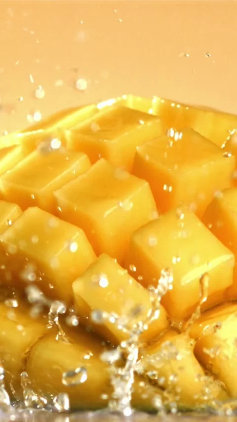 Raindrops fall on fresh mango. Filmed on a high-speed camera at 1000 fps Stock Footage 335308639