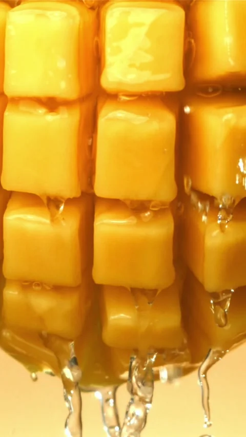 Raindrops fall on fresh mango. Filmed on a high-speed camera at 1000 fps Stock Footage 335311688