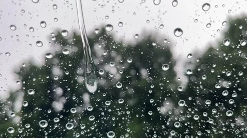 Raindrops fall on the glass Stock Footage 312967065