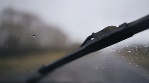 Raindrops fall on the glass while the car is moving Stock Footage 153231763