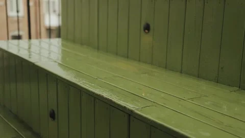 Raindrops fall on a green wooden surface. Heavy rain in the city. Raindrops on a Stock-Footage 318065618