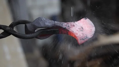 Raindrops fall on the hot iron of the ax. Stock-Footage 141767268
