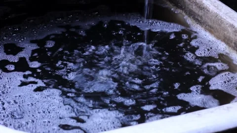 Raindrops fall into a large bathroom. Downpour. Rainy weather Stock Footage 148293518