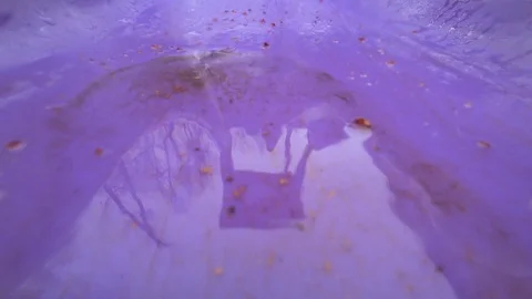 Raindrops fall on a purple children's slide. Stock Footage 110764098