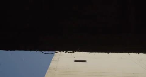 Raindrops fall from the roof while the sun is shining, Thailand Stock Footage 234868010