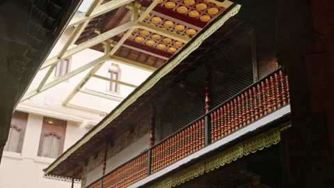 Raindrops fall at Sri Dalada Maligawa Temple as devotees walk barefoot Stock Footage 274664811