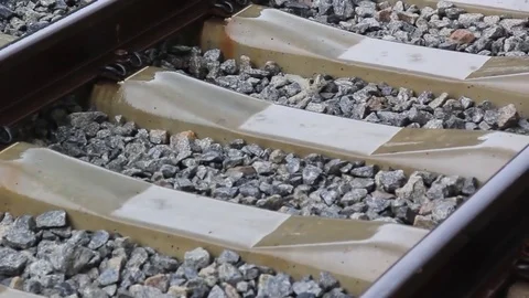 Raindrops fall on a train track Stock Footage 75892706