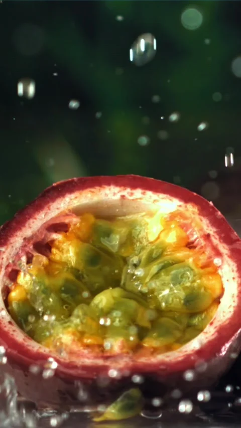 Raindrops fall on tropical passion fruit. Filmed on a high-speed camera at 1000 Stock Footage 335307249