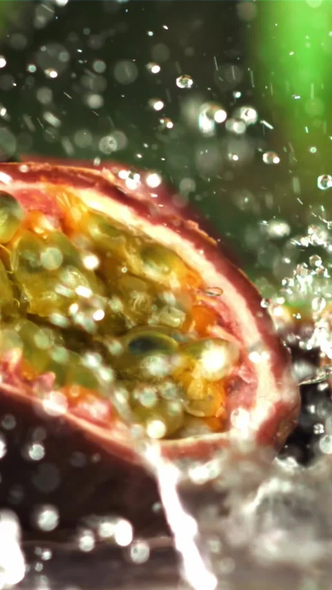 Raindrops fall on tropical passion fruit. Filmed on a high-speed camera at 1000 Stock Footage 335316539