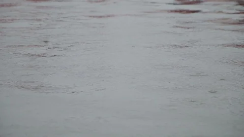 Raindrops fall into the water of a mountain river Video stock 120491941