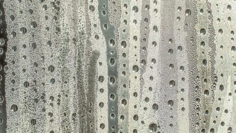 Raindrops fall on the window close-up. Rain, rainy, depressive, dreary weat.. Stock Photos