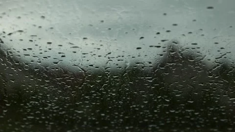 Raindrops fall on the window, rainy day Stock Footage 247266826