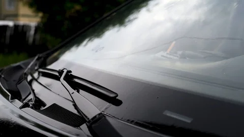 Raindrops fall on the windshield making it wet Video stock 91683463